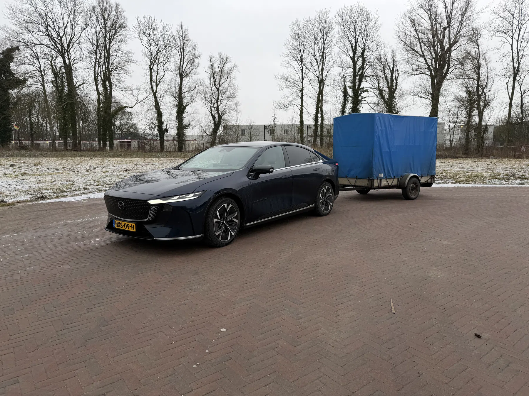 Mazda 6E met aanhanger
