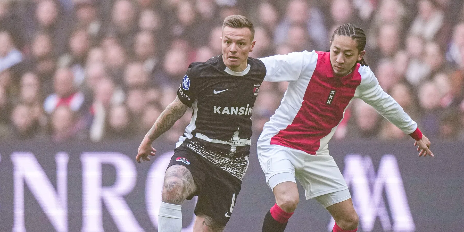 Afellay over Henderson en Clasie