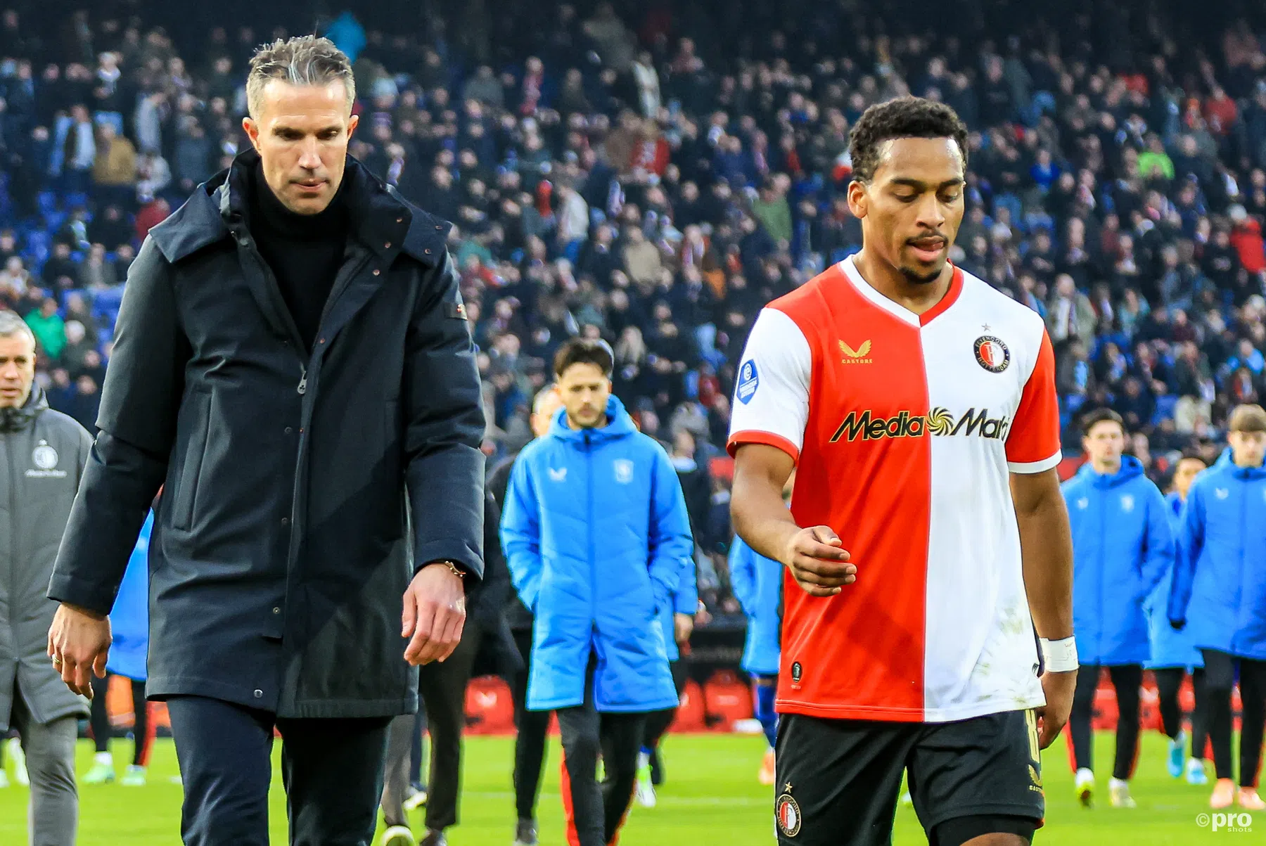 Quinten Timber looking focused on the pitch during a Feyenoord match.